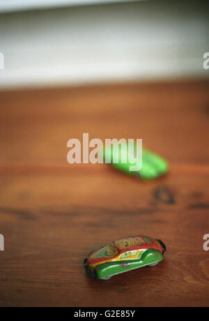Vintage Toy Cars on Wood Surface Stock Photo