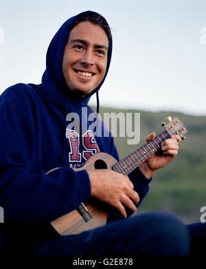 Young Man Playing Ukulele Stock Photo