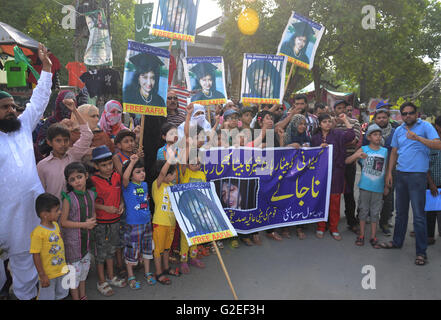 Pakistani activists of 'Afia movement' and civil society hold placards during demonstration to free the arrested Dr Afia Siddiqui from the New York prison, in Lahore. Afia Siddiqui born 2 March 1972 is a MIT trained Pakistani neuroscience, who was convicted on two counts of attempted murder of US nationals, officers, and employees, assault with a deadly weapon, carrying and using a firearm, and three counts of assault on US officers and employees. She is currently serving her 86 year sentence at the Federal Medical Center, Carswell in Fort Worth, Texas. (Photo by Rana Sajid Hussain/Pacific Pre Stock Photo