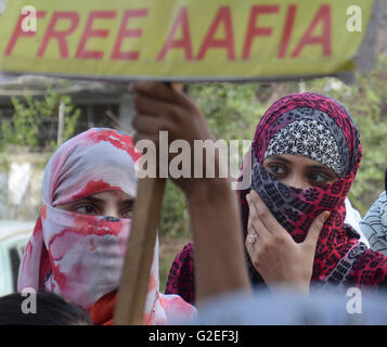 Pakistani activists of 'Afia movement' and civil society hold placards during demonstration to free the arrested Dr Afia Siddiqui from the New York prison, in Lahore. Afia Siddiqui born 2 March 1972 is a MIT trained Pakistani neuroscience, who was convicted on two counts of attempted murder of US nationals, officers, and employees, assault with a deadly weapon, carrying and using a firearm, and three counts of assault on US officers and employees. She is currently serving her 86 year sentence at the Federal Medical Center, Carswell in Fort Worth, Texas. (Photo by Rana Sajid Hussain/Pacific Pre Stock Photo