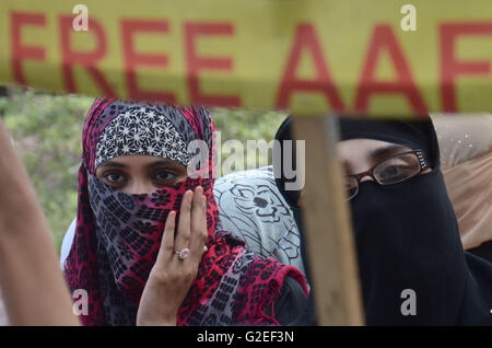 Pakistani activists of 'Afia movement' and civil society hold placards during demonstration to free the arrested Dr Afia Siddiqui from the New York prison, in Lahore. Afia Siddiqui born 2 March 1972 is a MIT trained Pakistani neuroscience, who was convicted on two counts of attempted murder of US nationals, officers, and employees, assault with a deadly weapon, carrying and using a firearm, and three counts of assault on US officers and employees. She is currently serving her 86 year sentence at the Federal Medical Center, Carswell in Fort Worth, Texas. (Photo by Rana Sajid Hussain/Pacific Pre Stock Photo