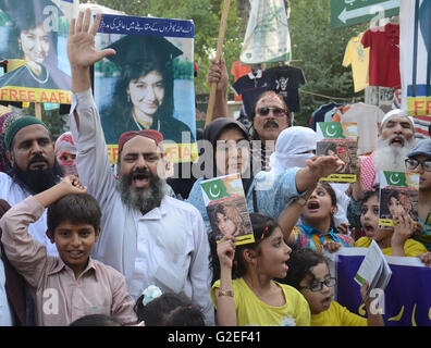 Pakistani activists of 'Afia movement' and civil society hold placards during demonstration to free the arrested Dr Afia Siddiqui from the New York prison, in Lahore. Afia Siddiqui born 2 March 1972 is a MIT trained Pakistani neuroscience, who was convicted on two counts of attempted murder of US nationals, officers, and employees, assault with a deadly weapon, carrying and using a firearm, and three counts of assault on US officers and employees. She is currently serving her 86 year sentence at the Federal Medical Center, Carswell in Fort Worth, Texas. (Photo by Rana Sajid Hussain/Pacific Pre Stock Photo