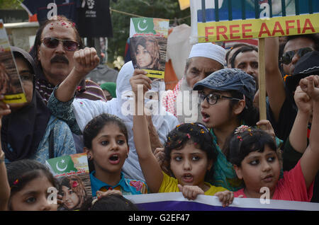 Pakistani activists of 'Afia movement' and civil society hold placards during demonstration to free the arrested Dr Afia Siddiqui from the New York prison, in Lahore. Afia Siddiqui born 2 March 1972 is a MIT trained Pakistani neuroscience, who was convicted on two counts of attempted murder of US nationals, officers, and employees, assault with a deadly weapon, carrying and using a firearm, and three counts of assault on US officers and employees. She is currently serving her 86 year sentence at the Federal Medical Center, Carswell in Fort Worth, Texas. (Photo by Rana Sajid Hussain/Pacific Pre Stock Photo