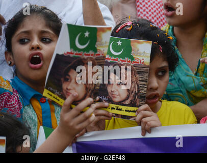 Pakistani activists of 'Afia movement' and civil society hold placards during demonstration to free the arrested Dr Afia Siddiqui from the New York prison, in Lahore. Afia Siddiqui born 2 March 1972 is a MIT trained Pakistani neuroscience, who was convicted on two counts of attempted murder of US nationals, officers, and employees, assault with a deadly weapon, carrying and using a firearm, and three counts of assault on US officers and employees. She is currently serving her 86 year sentence at the Federal Medical Center, Carswell in Fort Worth, Texas. (Photo by Rana Sajid Hussain/Pacific Pre Stock Photo