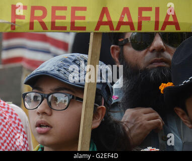 Pakistani activists of 'Afia movement' and civil society hold placards during demonstration to free the arrested Dr Afia Siddiqui from the New York prison, in Lahore. Afia Siddiqui born 2 March 1972 is a MIT trained Pakistani neuroscience, who was convicted on two counts of attempted murder of US nationals, officers, and employees, assault with a deadly weapon, carrying and using a firearm, and three counts of assault on US officers and employees. She is currently serving her 86 year sentence at the Federal Medical Center, Carswell in Fort Worth, Texas. (Photo by Rana Sajid Hussain/Pacific Pre Stock Photo