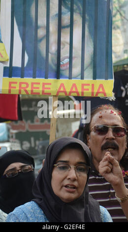 Pakistani activists of 'Afia movement' and civil society hold placards during demonstration to free the arrested Dr Afia Siddiqui from the New York prison, in Lahore. Afia Siddiqui born 2 March 1972 is a MIT trained Pakistani neuroscience, who was convicted on two counts of attempted murder of US nationals, officers, and employees, assault with a deadly weapon, carrying and using a firearm, and three counts of assault on US officers and employees. She is currently serving her 86 year sentence at the Federal Medical Center, Carswell in Fort Worth, Texas. (Photo by Rana Sajid Hussain/Pacific Pre Stock Photo