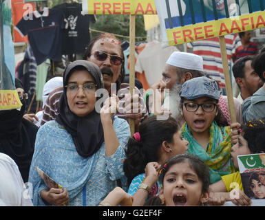 Pakistani activists of 'Afia movement' and civil society hold placards during demonstration to free the arrested Dr Afia Siddiqui from the New York prison, in Lahore. Afia Siddiqui born 2 March 1972 is a MIT trained Pakistani neuroscience, who was convicted on two counts of attempted murder of US nationals, officers, and employees, assault with a deadly weapon, carrying and using a firearm, and three counts of assault on US officers and employees. She is currently serving her 86 year sentence at the Federal Medical Center, Carswell in Fort Worth, Texas. (Photo by Rana Sajid Hussain/Pacific Pre Stock Photo