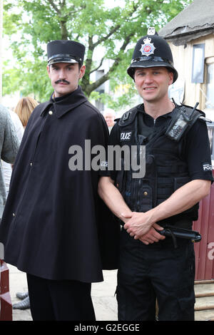 Ramsbottom, UK. 29th May, 2016. A Greater Manchester Police officer standing next to a man dressed as a French Officer in Ramsbottom, UK, 29th May, 2016 Credit:  Barbara Cook/Alamy Live News Stock Photo