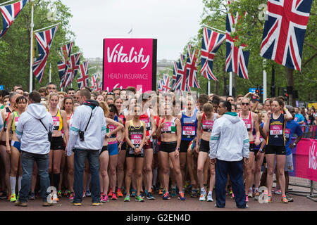 London, UK. 30 May 2016. Elite women runners line up at the start. The Vitality London 10000 m race takes place in Central London with runners and wheelchair athletes starting and finishing on The Mall. The event is also the British 10K road race Championships. Credit:  Vibrant Pictures/Alamy Live News Stock Photo