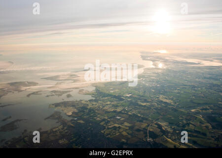 Horizontal aerial view of the Isle of Sheppey and Thames estuary across the Kent countryside. Stock Photo