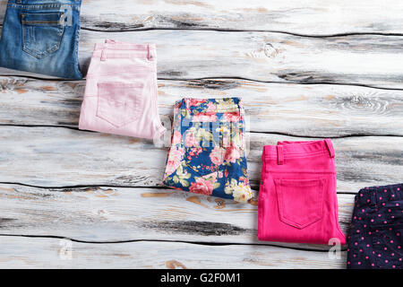 Pink trousers and blue jeans. Stock Photo
