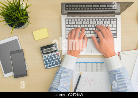 Businessman making calculation Stock Photo