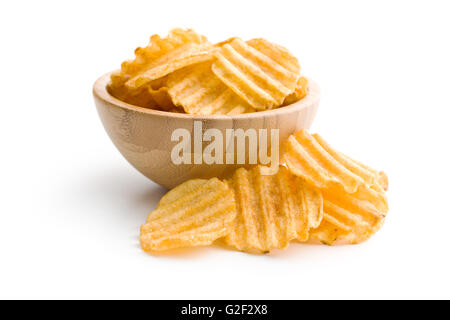 Crinkle cut potato chips isolated on white background. Tasty spicy potato chips in bowl. Stock Photo