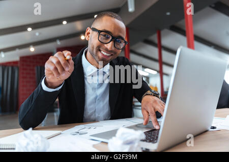 Young handsome businessman pointing at you Stock Photo
