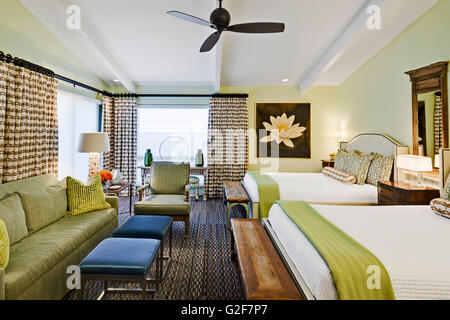 Hotel Room with Two Double Beds and Sitting Area Stock Photo