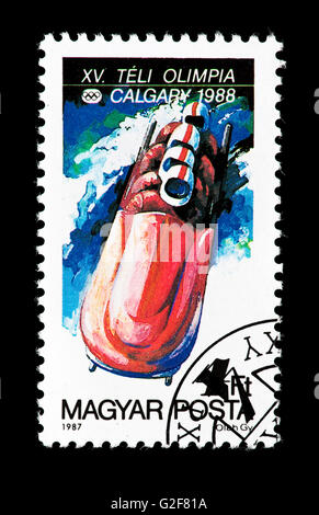 Postage stamp from Hungary depicting a four man bobsled, issued for the 1988 Calgary Winter Olympic Games. Stock Photo