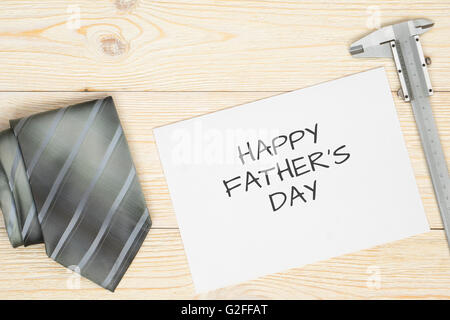 necktie, notepad and calipers background Stock Photo