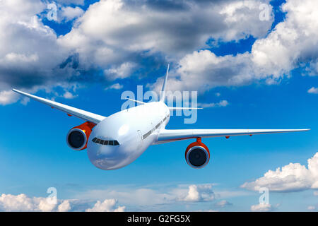 Big airplane above the clouds. Airliner in the heaven. Commercial plane on the sky. Stock Photo