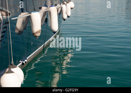 Side markers on the side of a boat, sea markers and buoys at Zea Marina in Athens, Greece. Stock Photo