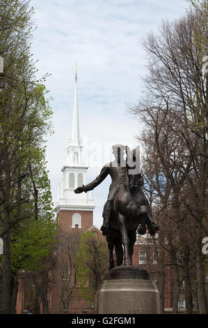 Equestrian statue of Paul Revere with Old North Church steeple behind Boston, Massachusetts, USA Stock Photo