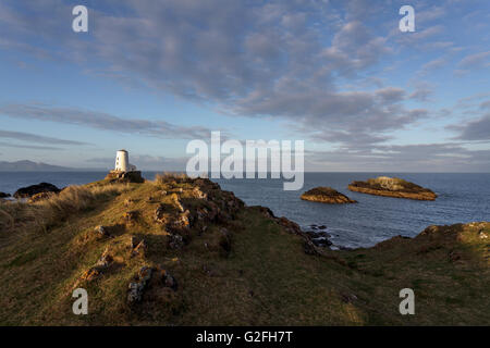 Tŵr Mawr Lighthouse on Llanddwyn Island, Anglesey, North Wales UK at sunrise. Stock Photo