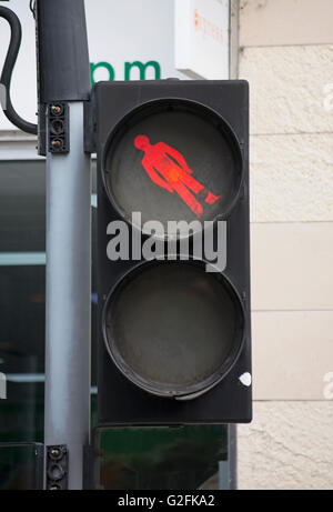 british pelican crossing with pictogram of red man at unusual angle, kingston upon thames, surrey, england Stock Photo