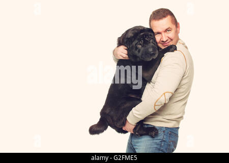 Man with sharpei dog Stock Photo