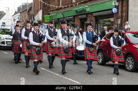 Ayr Pipe band parading down Loudon Street, Mauchline, south Ayrshire as part of Mauchline Holy Fair. Stock Photo