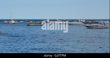 Party boats moored off of Milton Olive Park in 'the Playpen' a protected breakwall on Chicago's lake front during the Memorial Day weekend. Stock Photo