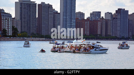 Party boats moored off of Milton Olive Park in 'the Playpen' a protected breakwall on Chicago's lake front during the Memorial Day weekend. Stock Photo