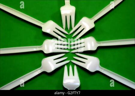 Fork white with plastic snack bar  on green bottom. Stock Photo