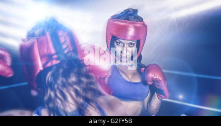 Composite image of rear view of fighter flexing muscles Stock Photo