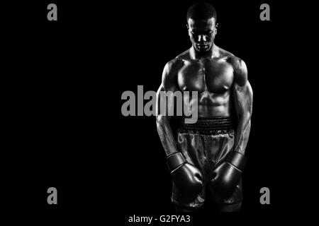 Composite image of boxer posing after failure Stock Photo