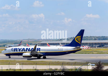 Airliner -Boeing 737-, of -Ryanair- airline, is going direction to runway, ready to take off from Madrid airport (Spain) Stock Photo