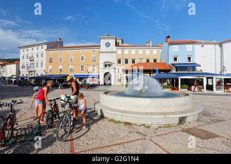 Tourists and bicycles in Cres town Stock Photo