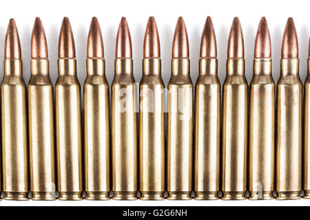 Golden color bullets in a row on white background with shadow Stock Photo