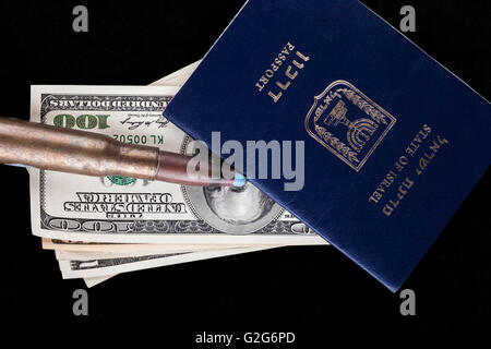 Israelian passport with dollar banknotes and a rifle bullet isolated on black background Stock Photo