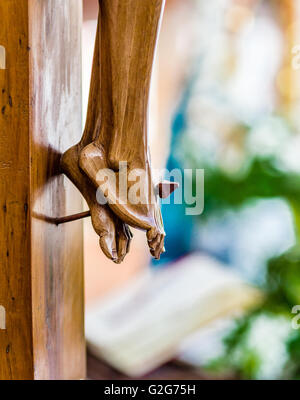 nailed feet , detail of wooden statue of Jesus Christ crucified Stock Photo