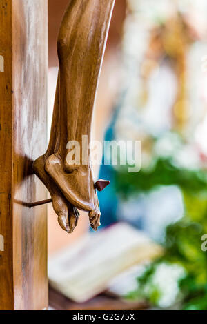 nailed feet , detail of wooden statue of Jesus Christ crucified Stock Photo