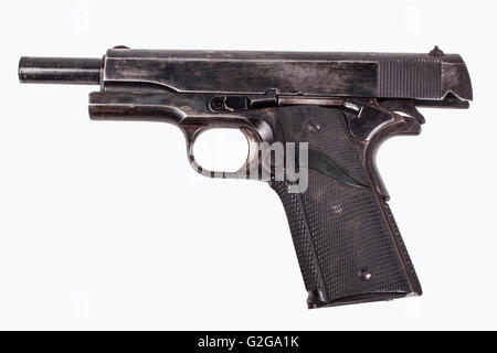 Black old pistol with scratches isolated on white background Stock Photo