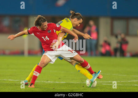 Julian Baumgartlinger, No. 14 Austria, and Zlatan Ibrahimovic, No. 10 Sweden, fight for the ball during the world cup qualifier Stock Photo