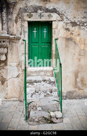 Green church door in back of the holly sepulcher church in jerusalem Stock Photo