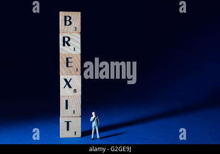 Brexit spelled out with undecided businessman Stock Photo