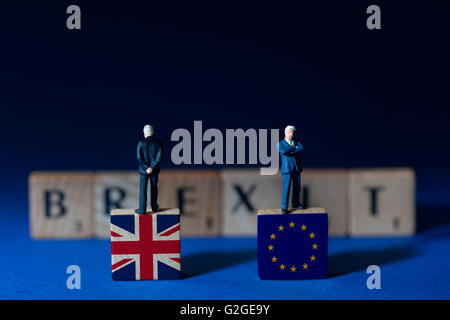 Brexit spelled out with undecided businessman standing on UK and EU flags Stock Photo