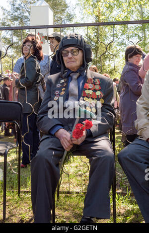 Elderly Great Patriotic World War II Russian veteran wearing medals as part of the 9th of May victory celebration in Russia Stock Photo