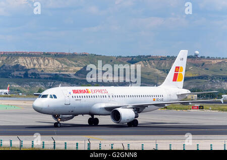 Airliner -Airbus A320-, of -Iberia Express- airline, is going direction to runway, ready to take off from Madrid airport. Stock Photo