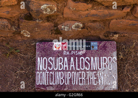 Polite reminder not to climb on the Incan ruins at Pisac in Peru Stock Photo