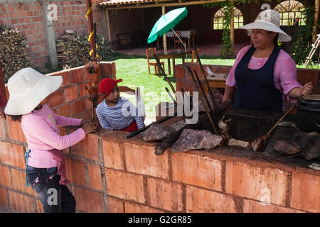 Guinea Pigs being roasted on sticks in the Peruvian town of Lamay where they are a special treat each Sunday Stock Photo