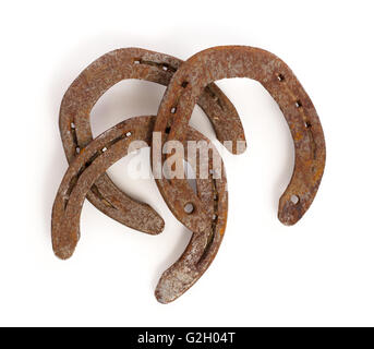 Old rusty horseshoes, isolated on a white background Stock Photo