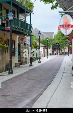 Eateries and shops along the narrow brick-paved Hypolita Street in Old Town St. Augustine, Florida, USA. Stock Photo